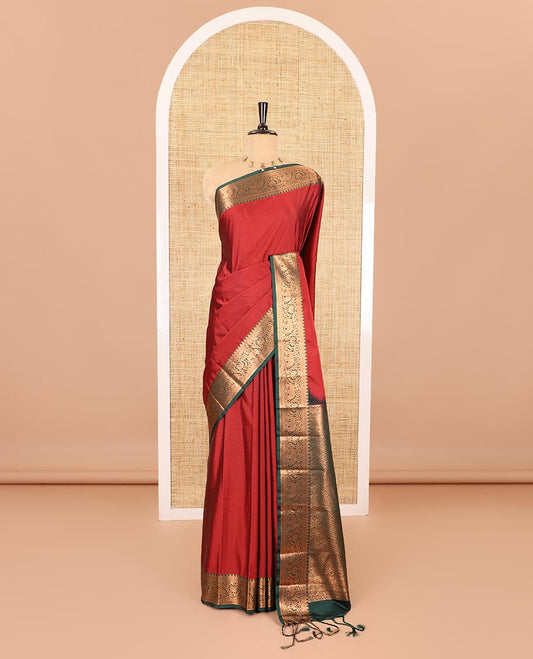 Maroon plain luxury soft silk saree, contrast traditional temple zari border of elephant motifs, geometric zari pallu, and a contrast jacquard blouse