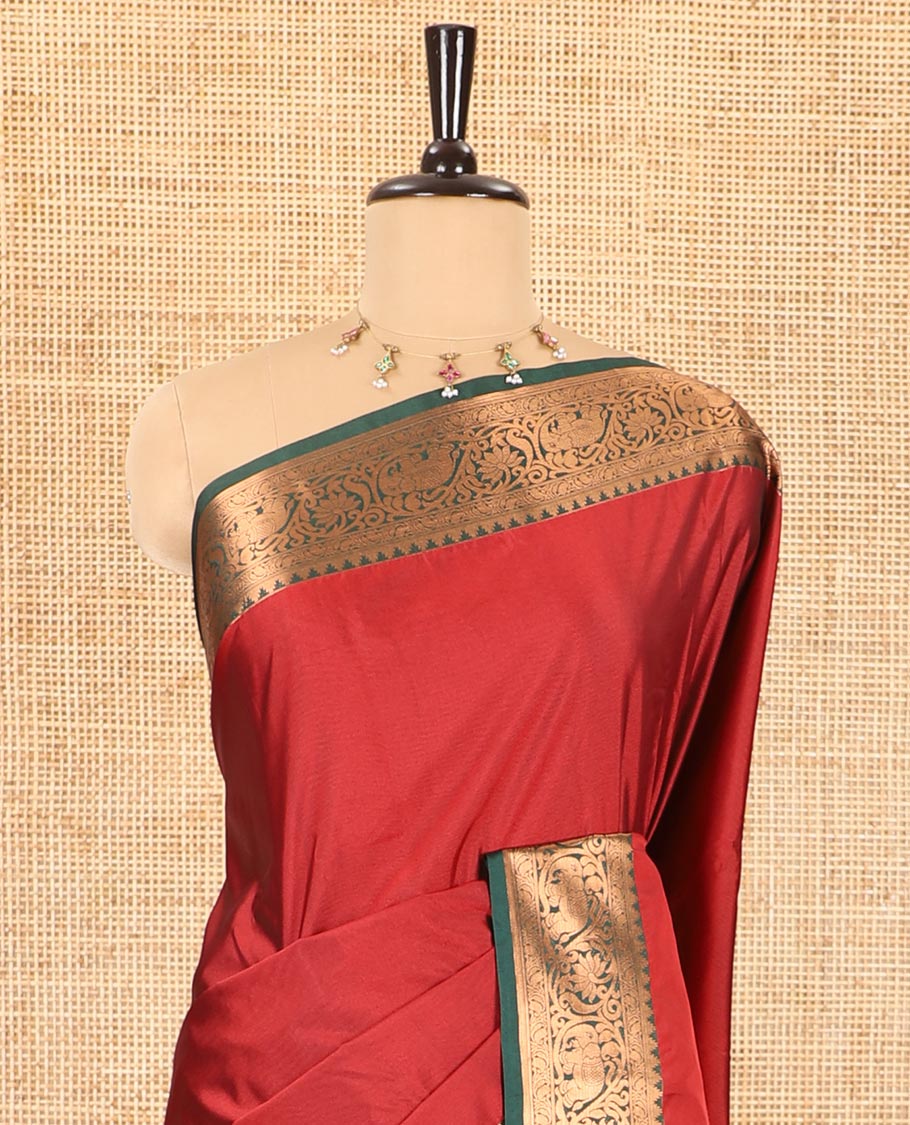 Maroon plain luxury soft silk saree, contrast traditional temple zari border of elephant motifs, geometric zari pallu, and a contrast jacquard blouse