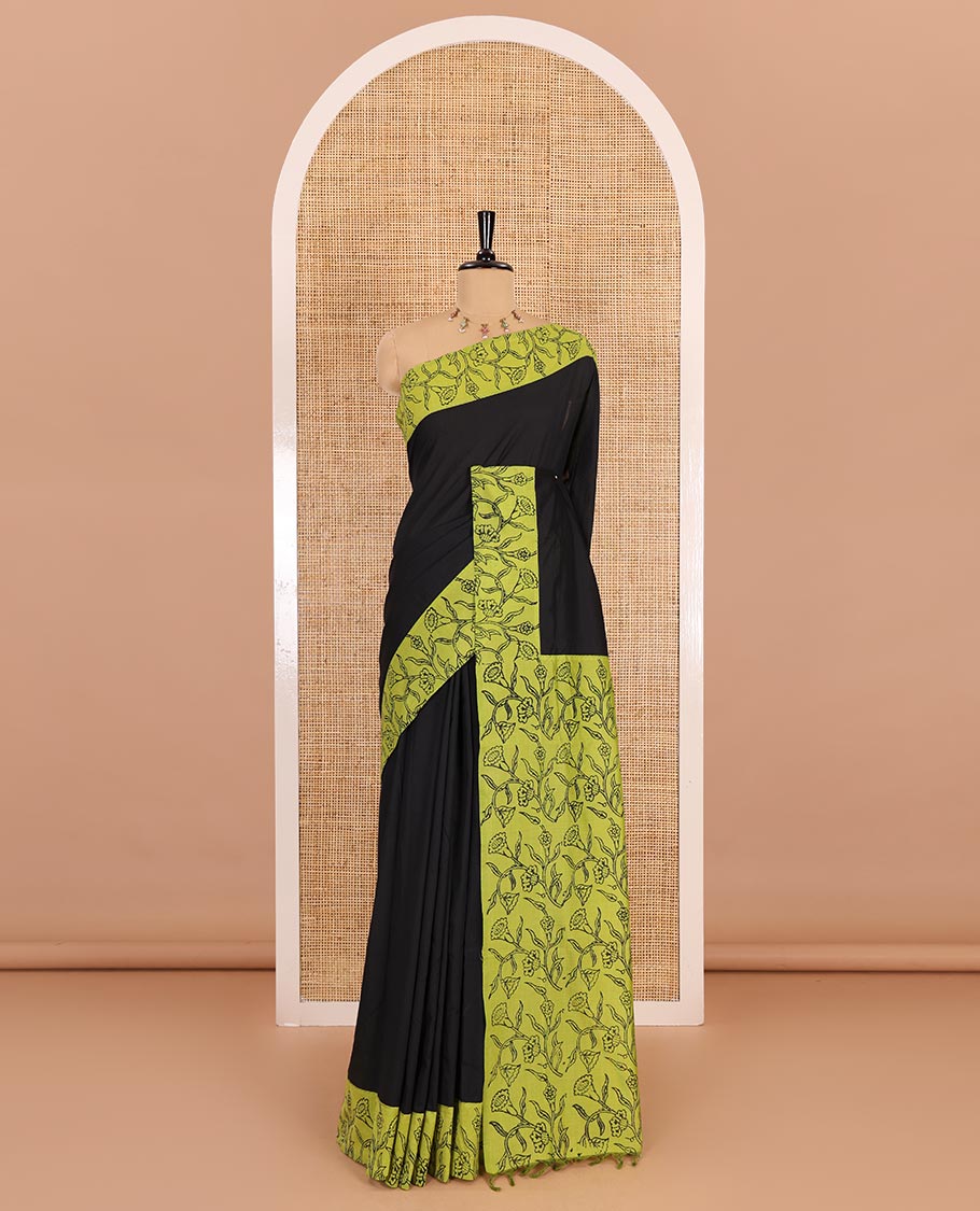 Black plain South cotton saree, contrast block printed border, and pallu of floral vine print, and floral vine printed blouse
