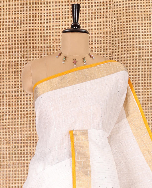 White and yellow sequins striped Linen cotton saree, contrast zari sequins striped border, striped pallu, and a contrast plain blouse