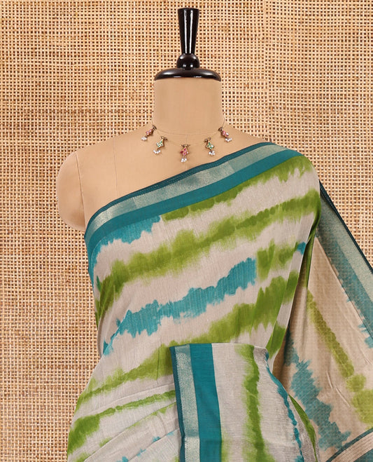 Rama shibori printed muslin cotton saree, contrast zari border, village theme printed pallu, and a contrast dots printed blouse