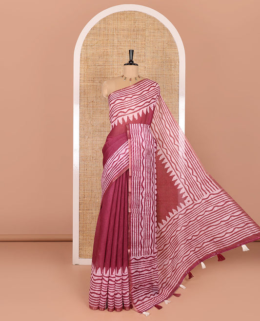 Wine plain linen cotton saree, temple zig-zag striped batik printed border, batik printed pallu, and triangle motifs batik printed blouse