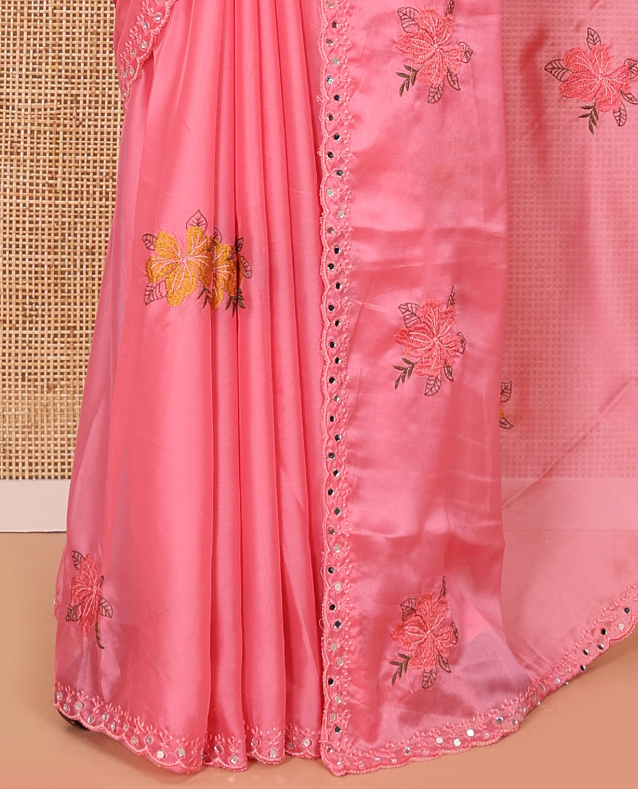 Pink floral motifs embroidered rangoli chiffon saree with mirror work border, embroidered pallu, and a contrast intricate scallop design embroidered blouse