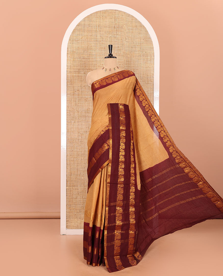 Sandal plain sungudi cotton saree with contrast traditional border of peacocks, zari striped pallu, and a contrast zari checked blouse