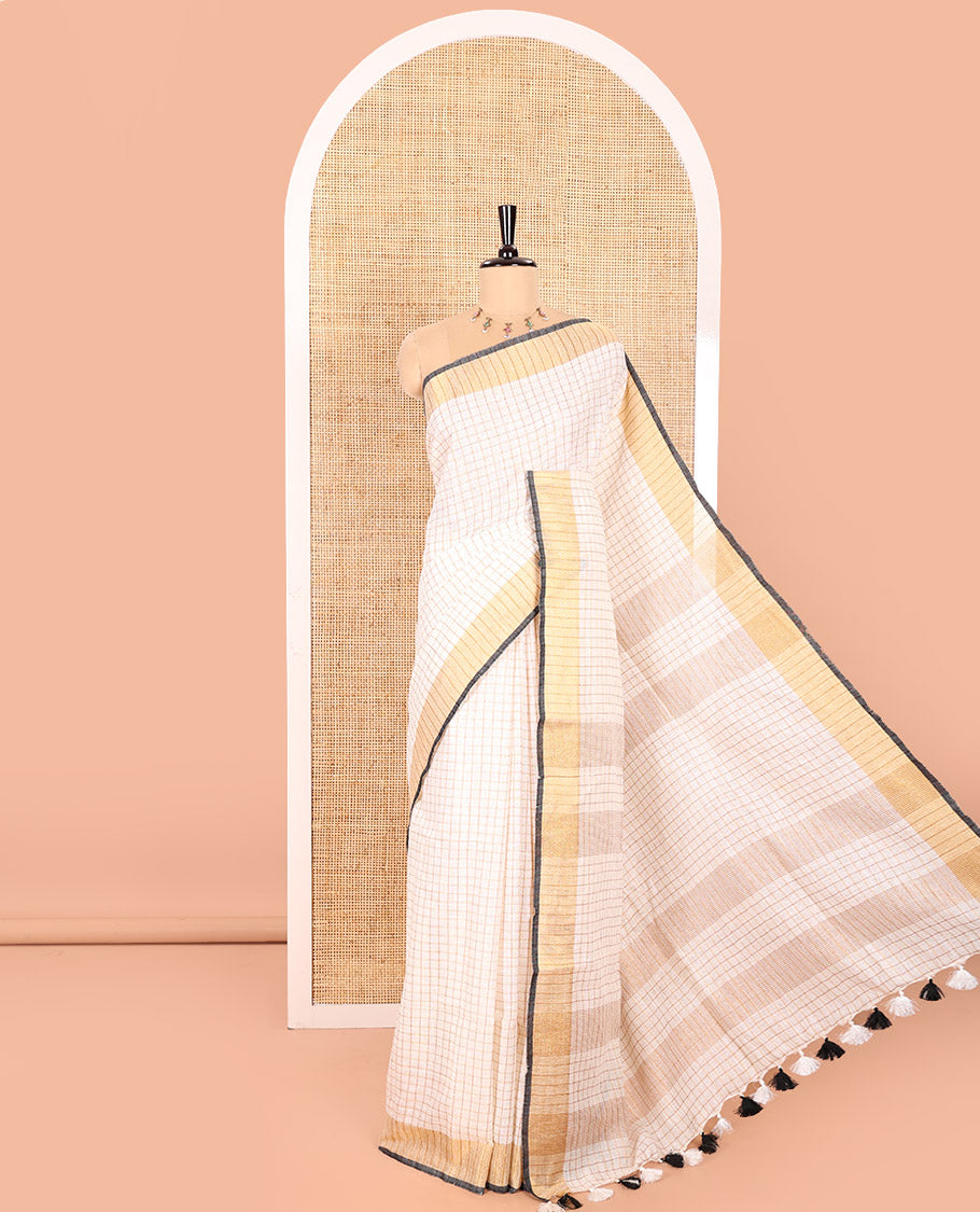 Cream and Black Linen Saree Sparsely Sparkled with Checks, Subtly Designed Zari Border, Zari Striped Pallu, and Paired with a Contrast Blouse