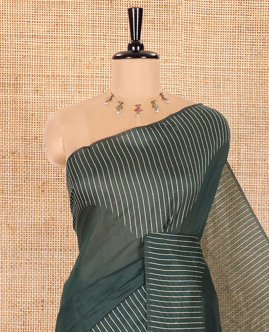 Borderless Dark Green Chanderi Cotton Saree Prettified with with Sequins and Thread Stripes, Self-Pallu Featuring Sequins and Thread Stripes, and comes with a Matching Blouse