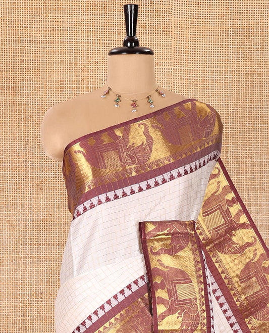 White Semi-Taffeta Saree, Adorned  with Medium-Zari Checks All Over Its Body, Complemented by Contrast Temple Border Featuring Elephant Motifs, Contrast Checked Pallu, and Paired with a Matching Blouse