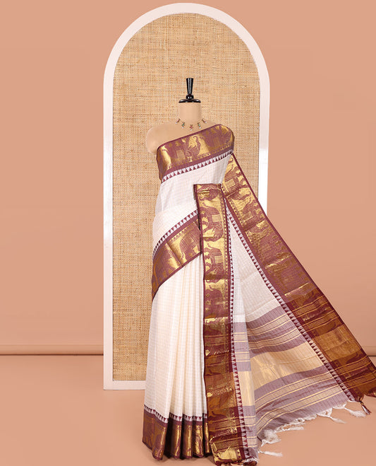 White Semi-Taffeta Saree, Adorned  with Medium-Zari Checks All Over Its Body, Complemented by Contrast Temple Border Featuring Elephant Motifs, Contrast Checked Pallu, and Paired with a Matching Blouse