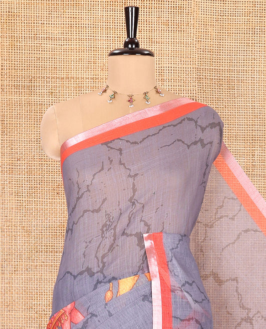 Grey Linen Cotton Saree, Bedecked with Batik Vines and Camel Motifs Printed on Its Body, Complemented by a Contrast Piping Border, Pallu of God and Goddess Figurines, and Paired with a Contrast Blouse