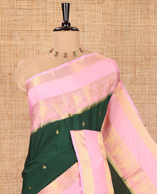 Green Art Mysore Silk Saree, Enriched with Zari Buttas All Over Its Body, Complemented by a Contrast  Traditional Zari Rettai Pettu Border of Peacock and Jaal Designs, Subtly Zari Striped Pallu, and Paired with a Contrast Blouse