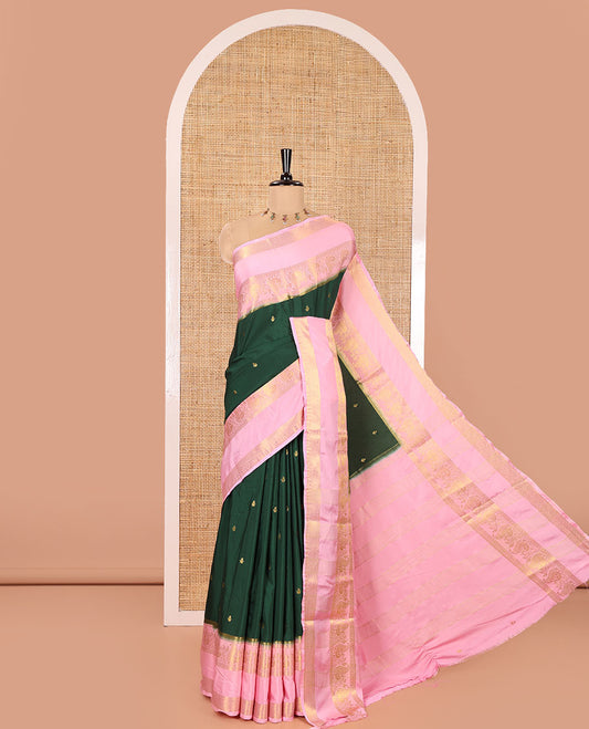Green Art Mysore Silk Saree, Enriched with Zari Buttas All Over Its Body, Complemented by a Contrast  Traditional Zari Rettai Pettu Border of Peacock and Jaal Designs, Subtly Zari Striped Pallu, and Paired with a Contrast Blouse