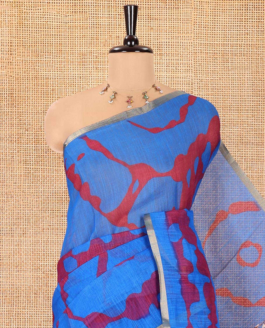 Royal Blue Linen Cotton Saree, Bedecked with Shibori Printed on Its Body, Subtle Piping Border, Pallu of Floral Vine Print, and Paired with a Contrast Floral Vine Printed Blouse