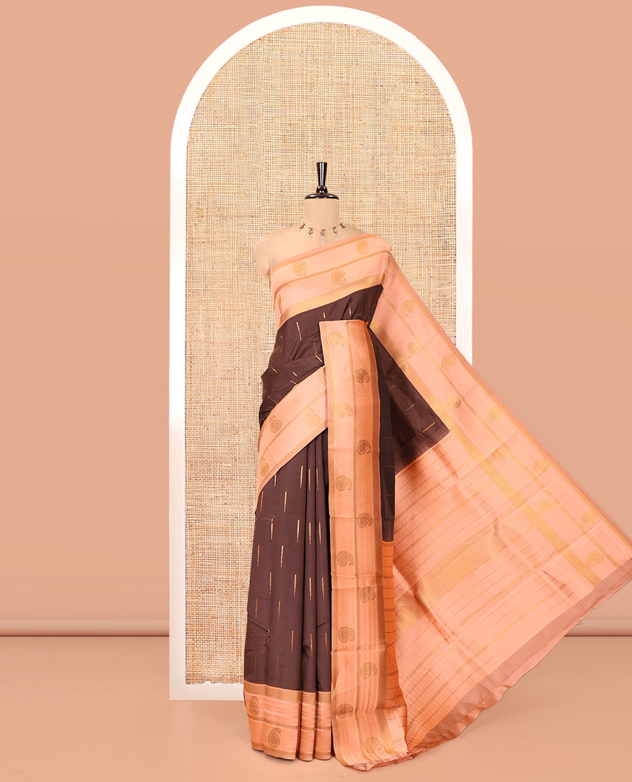 Brown and Peach Kanchi Silk Saree, Elevated with Zari Buttas All Over Its Body, Complemented by a Contrast Border of Paisleys, Zari-Striped Pallu, and Paired with a Contrast Jacquard Blouse