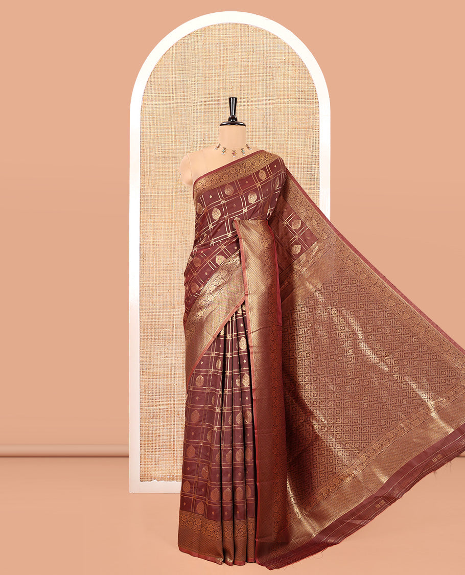 Brown Kanchi Silk Saree, Accentuated with Zari Butta Enclosed Checks All Over Its Body, Highlighted by Traditional Zari Border of Floral Creeper Designs, a Grand Jaal Pallu, and Paired with a Jacquard Blouse