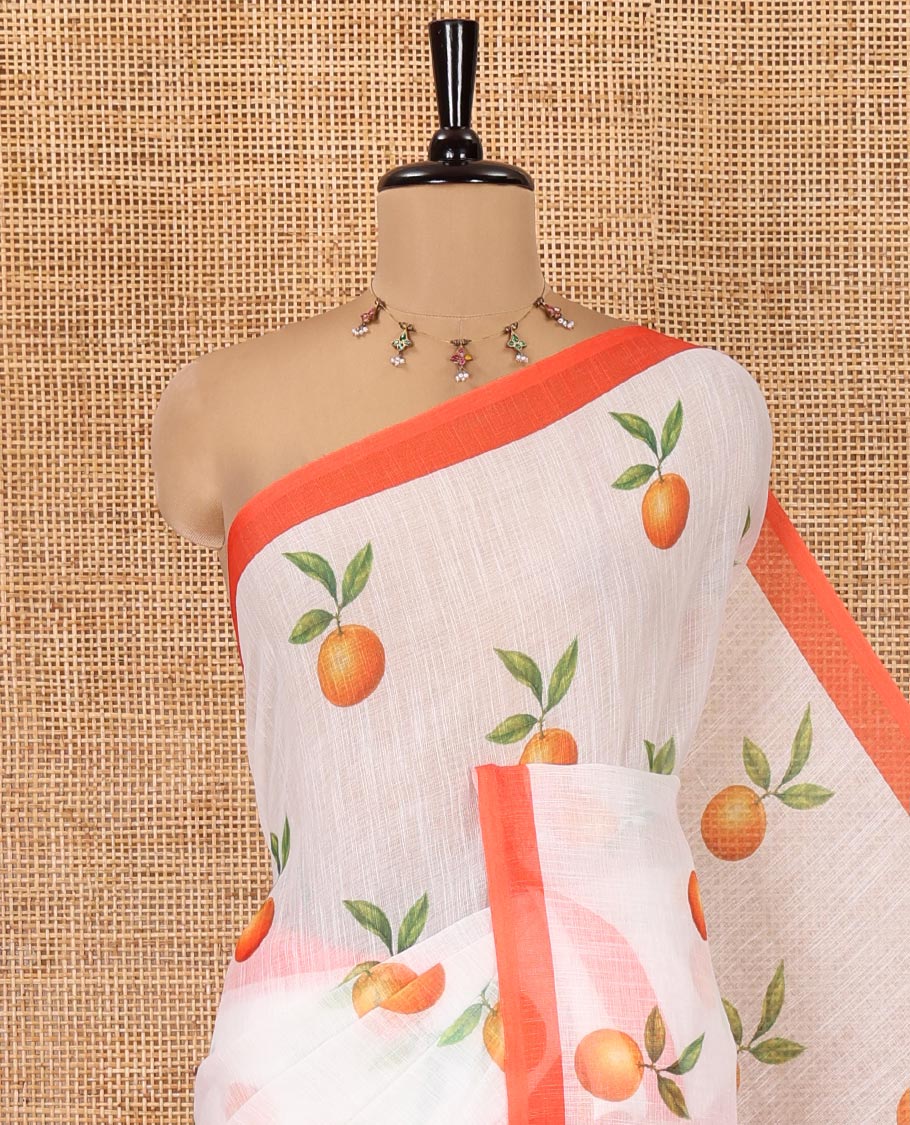 White Linen Cotton Saree, Artfully Printed with Orange Motifs All Over Its Body, Complemented by a Contrast Border, Geometric-Printed Pallu, and Paired with a Contrast Blouse