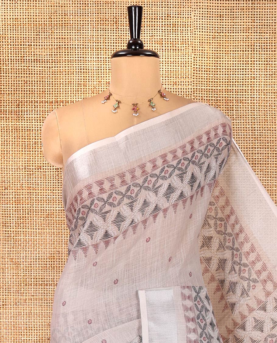 Chikku Linen Saree, Decorated with Buttas and Geometric Print on Its Body, Highlighted by Zari Bavanji Border, Pallu of Same Geometric Print, and Paired with a Contrast Blouse