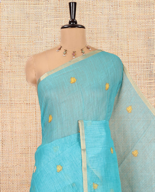 Blue Linen Cotton Saree, Beautified with Lotus Motifs Print, a Piping Border, Contrast Floral Vine Pallu, and a Contrast Blouse