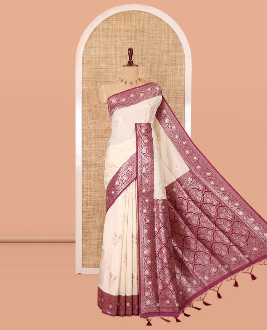Cream-Purple Elite Soft Silk Saree, Ornamented  with Zari Buttas, a Contrast Floral Creeper Border, Intricate Pallu, and a Contrast Blouse