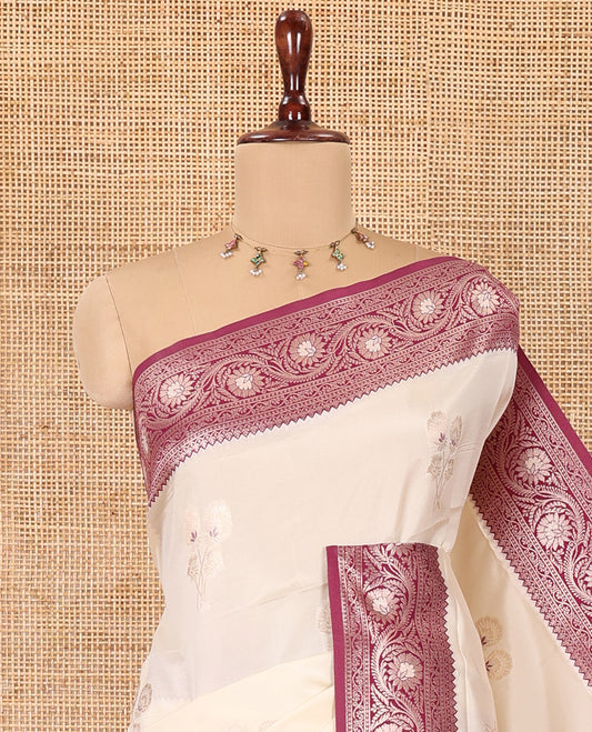 Cream-Purple Elite Soft Silk Saree, Ornamented  with Zari Buttas, a Contrast Floral Creeper Border, Intricate Pallu, and a Contrast Blouse