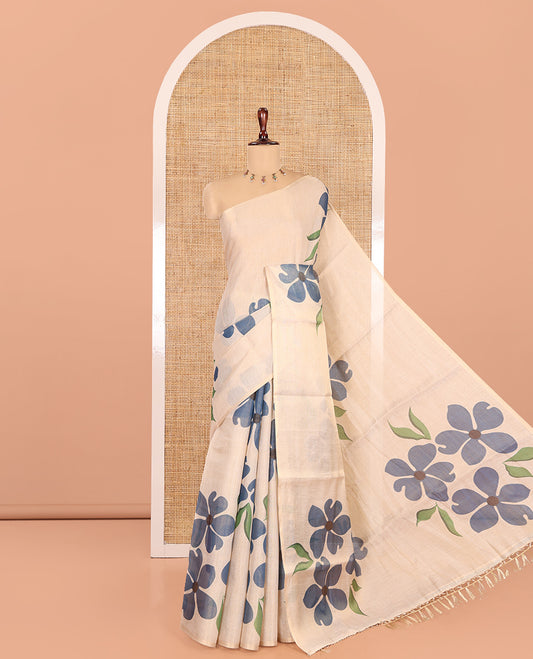Borderless Cream-Blue Tissue Saree Features Floral Print, a Floral Printed Pallu, and a Contrast Blouse