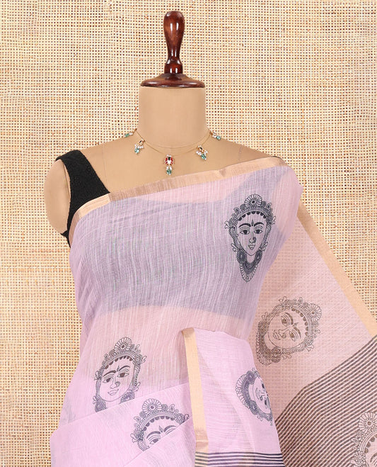 Borderless Baby Pink Linen Cotton Saree Features Face Print, Contrast Pallu of Chevron Stripes and Face Print, a Contrast Blouse