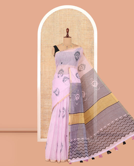 Borderless Baby Pink Linen Cotton Saree Features Face Print, Contrast Pallu of Chevron Stripes and Face Print, a Contrast Blouse