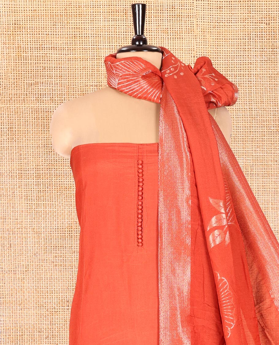 Rust Semi-Silk Material Chudidar Set, Adorned with Pom-Pom Necklined Top, a Plain Santoon Bottom, and Paired Floral Zari Woven Semi-Silk Dupatta