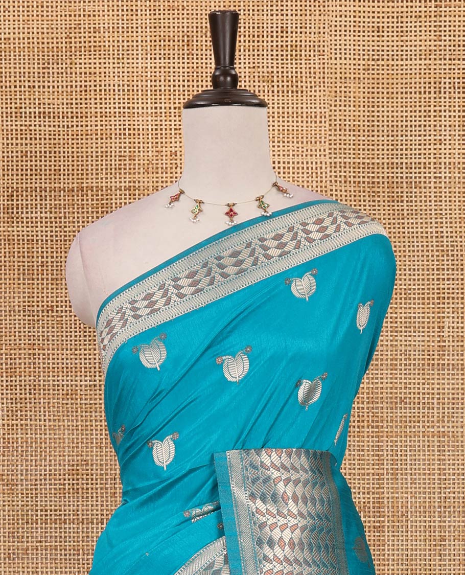 Blue leaf zari buttas dola silk saree, geometric patterned zari border, pallu of geometric pattern & diagonal stripes & plain blouse