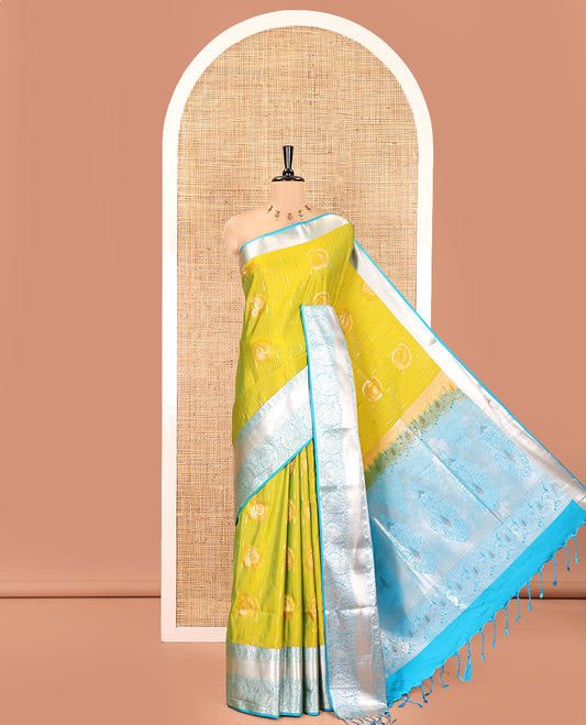 Parrot Green Semi-Soft Silk Saree, Elegantly Crafted with Vaira Oosi, and Paisley Buttas All Over Its Body, Complemented by Contrast Traditional Border of Paisleys, Intricately Designed Pallu, and Paired with a Contrast Blouse
