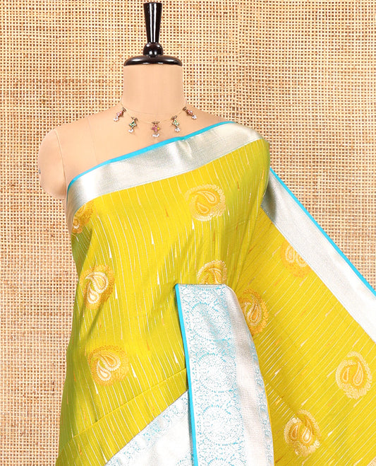 Parrot Green Semi-Soft Silk Saree, Elegantly Crafted with Vaira Oosi, and Paisley Buttas All Over Its Body, Complemented by Contrast Traditional Border of Paisleys, Intricately Designed Pallu, and Paired with a Contrast Blouse