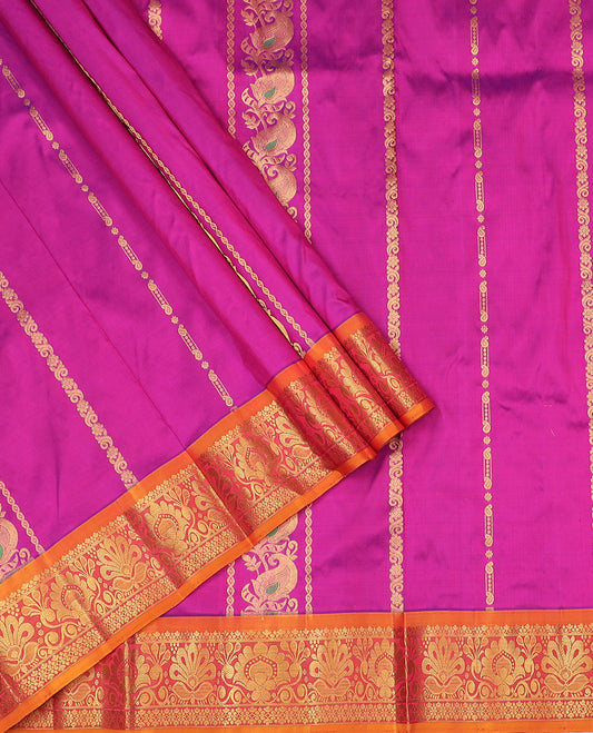 Rani Pink Pure Silk Half-Saree Embellished with Zari Designs on the Skirt, Complemented by a Contrast Zari-Design Border, Paired with a Contrast Blouse, and Featuring a Jaal-Designed Dhavani