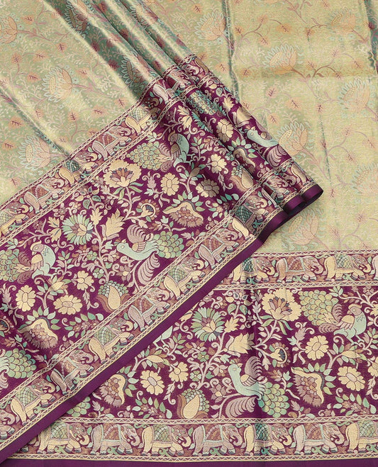 Green Pure Silk Half-Saree, Artfully Detailed with Floral Jacquard All Over Its Skirt, Complemented by a Contrast Border of Yaanai, Mayil, and Kodi Visiry Designs, Paired with a Contrast Blouse, and Comes with an Intricately Designed Dhavani