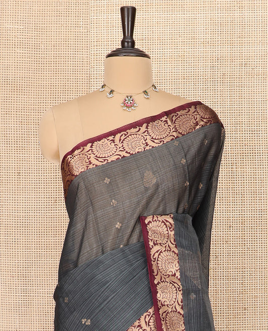 Grey Silk Cotton Saree Beautified with Buttas All Over the Body, Complemented by a Contrast Floral Creeper Zari Border, Featuring a Contrast Pallu of Floral Zari Designs, and Paired with a Contrast Blouse