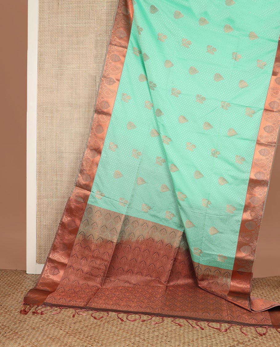 Green embossed and zari buttas soft silk saree, contrast paisley zari design border, and pallu of scallop designs