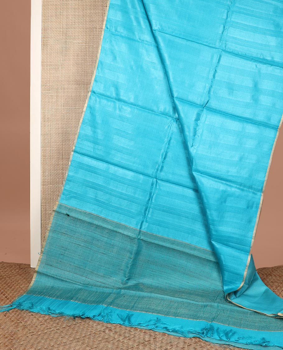 Borderless sky blue sparsely striped tussar silk saree, striped pallu