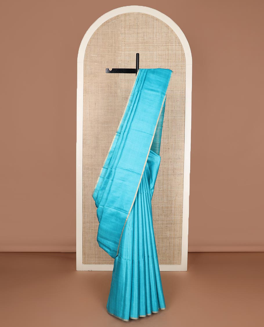 Borderless sky blue sparsely striped tussar silk saree, striped pallu
