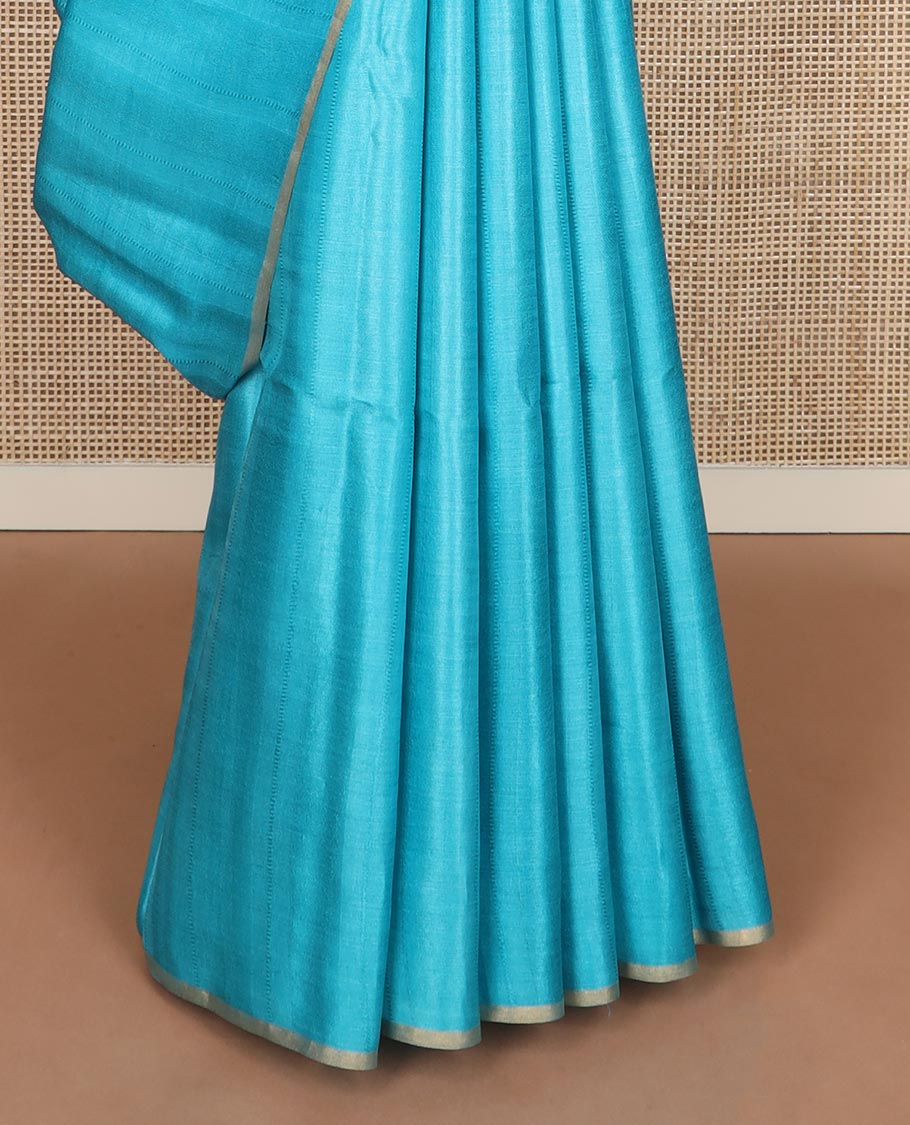 Borderless sky blue sparsely striped tussar silk saree, striped pallu