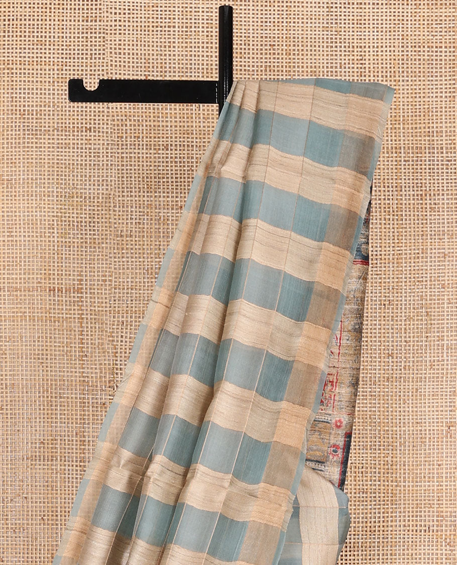 Borderless blue checked tussar saree, contrast pallu pictures pichwai cow, floral creeper, paisley, elephant, dancing kathak girl & swan figurines, with printed blouse