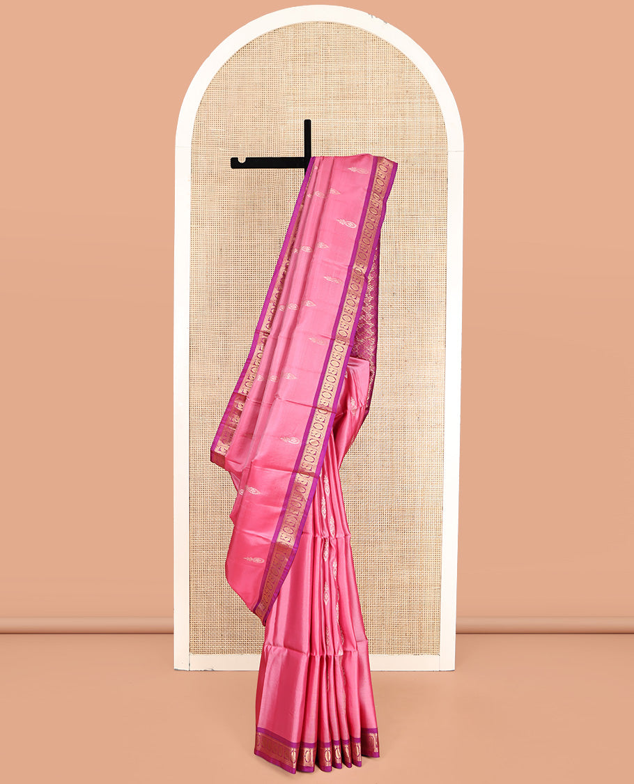 Pink Uppada Silk Saree, Ornamented with Zari Buttas, a Contrast Peacock-Chakram Border, Grand Pallu, and a Contrast Blouse