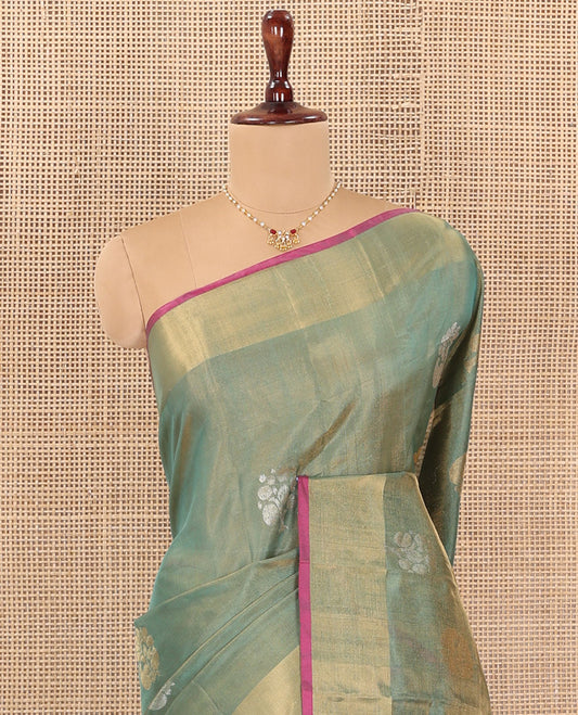 Green Uppada Silk Saree Bedecked with Zari Buttas, Complemented by Bavanji Border, Captivating Contrast Pallu of Floral-Paisley Design Weave, and Paired with a Contrast Blouse