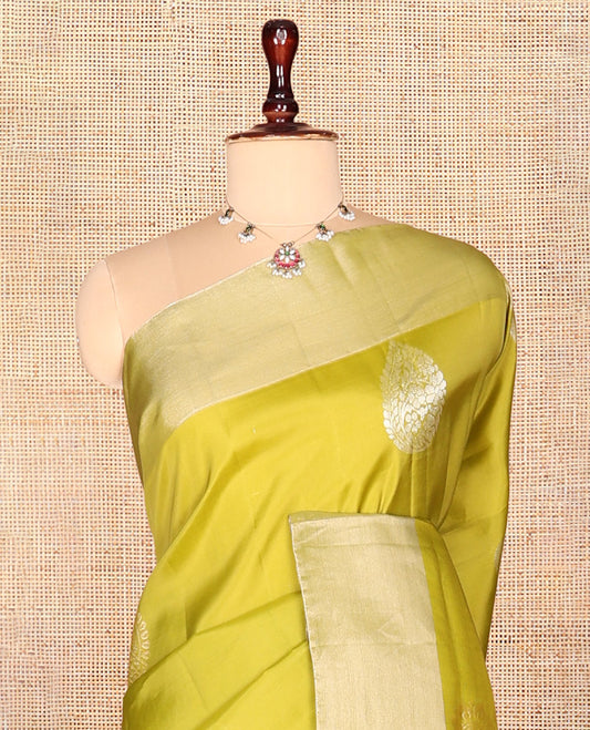 Green Semi Uppada Saree, Embellished with Zari Buttas, a Bavanji Border, Contrast Diagonal Leaf Vine Pallu, and a Contrast Blouse