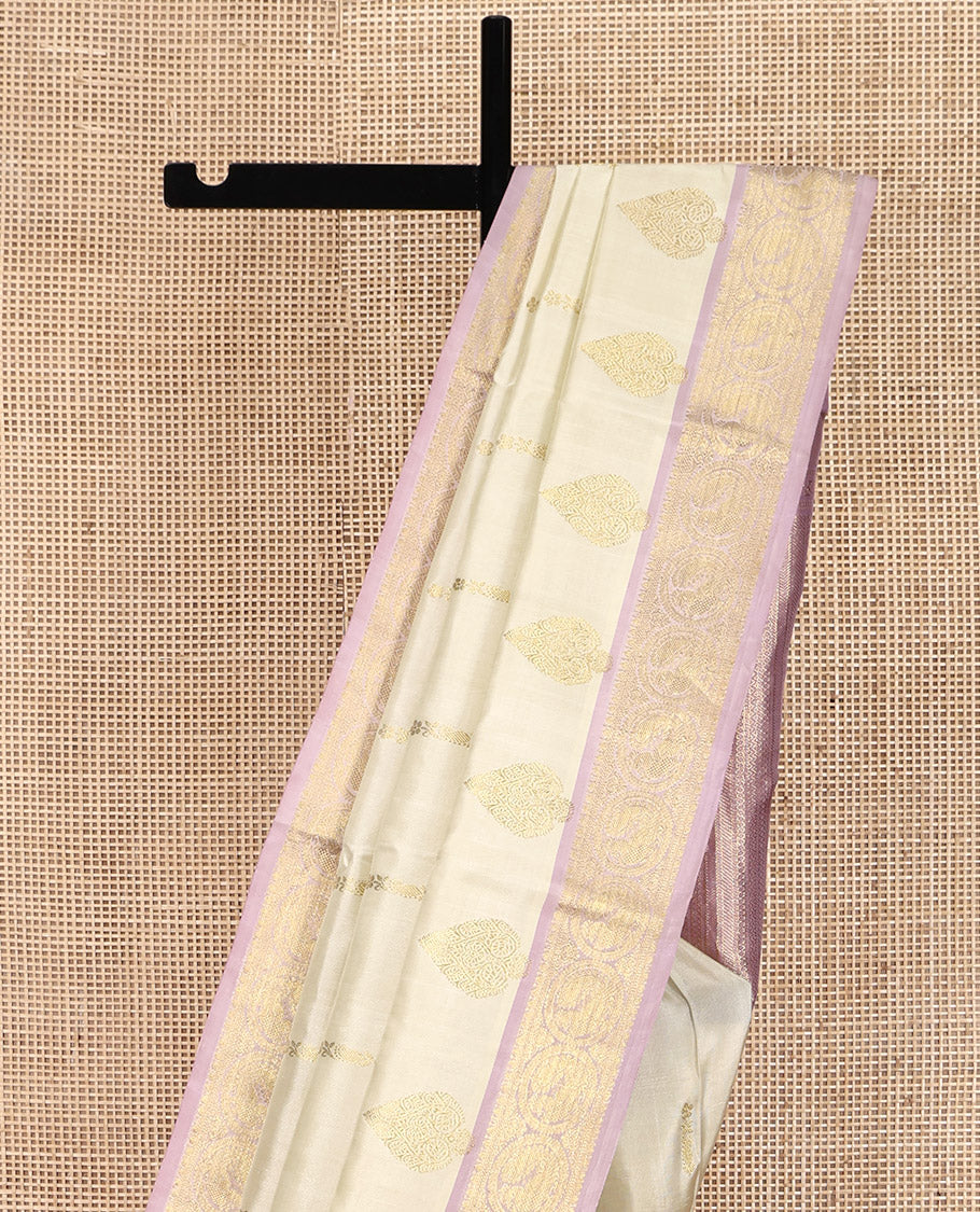 Off-White Venkatagiri Silk Saree, Spotlighted with Zari Buttas All Over Its Body, Complemented by a Contrast Traditional Zari Design Border, Grand Pallu, and Paired with a Contrast Blouse