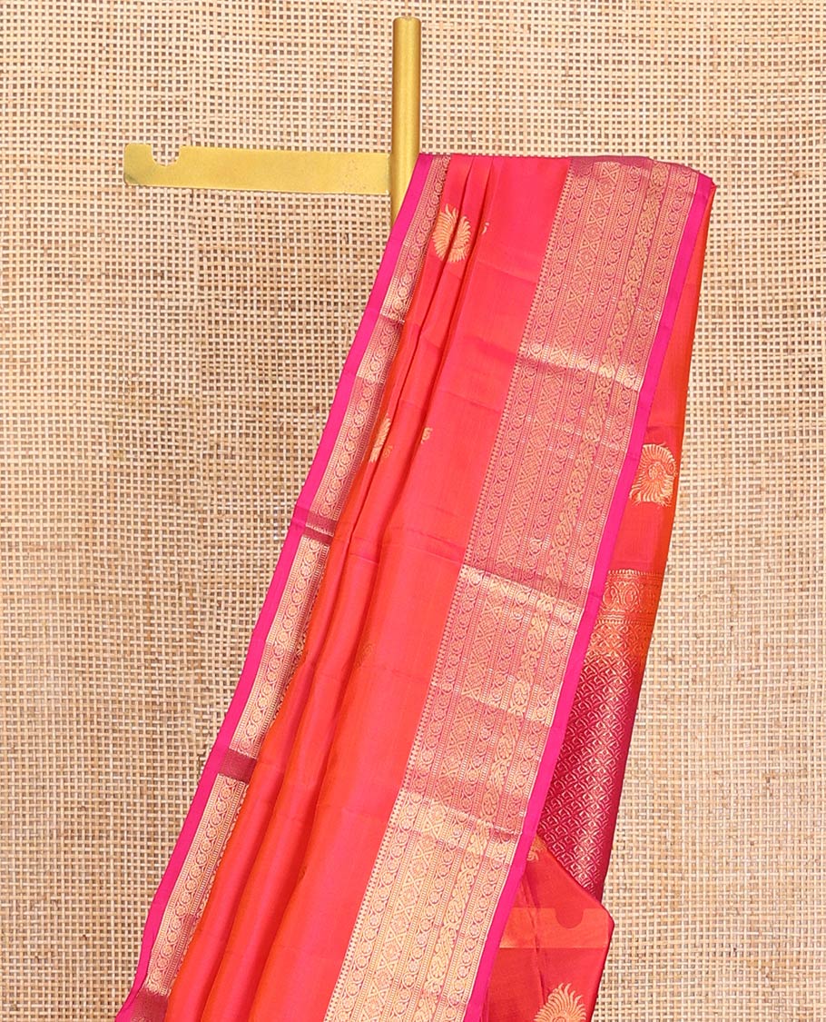 Orange Dual-Tone Vasundhara Lite-Silk Mix Saree, Adorned with Zari Buttas, Complemented by Contrast Border Featuring Thilakam Mokku, Kodi Visiry, Muthu, Laddu Kamalam, and Mayil Designs, Grandly Pallu of Scallop Designs, and Paired with a Contrast Blouse