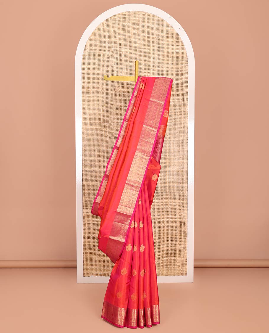 Orange Dual-Tone Vasundhara Lite-Silk Mix Saree, Adorned with Zari Buttas, Complemented by Contrast Border Featuring Thilakam Mokku, Kodi Visiry, Muthu, Laddu Kamalam, and Mayil Designs, Grandly Pallu of Scallop Designs, and Paired with a Contrast Blouse