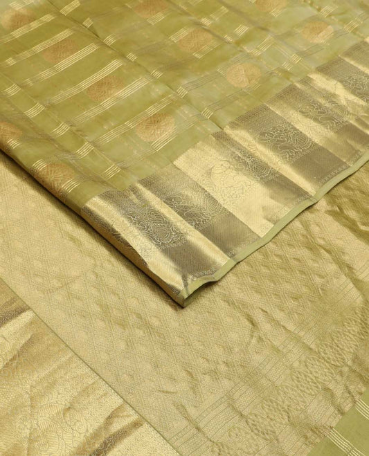 Green zari buttas and checked Vasundhara silk mix saree, zari border of mayil designs, and  zari-rich jaal pallu