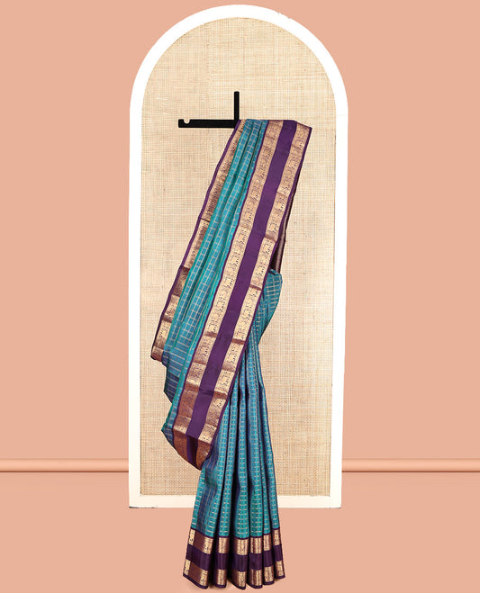 Blue Vasundhara Lite Silk Mix Saree, Spotlighted with Checks, Complemented by a Contrast Rettai Pettu Border of Thilakam Mokku, Yaanai and Mayil Design, Jaal Pallu, and a Contrast Blouse