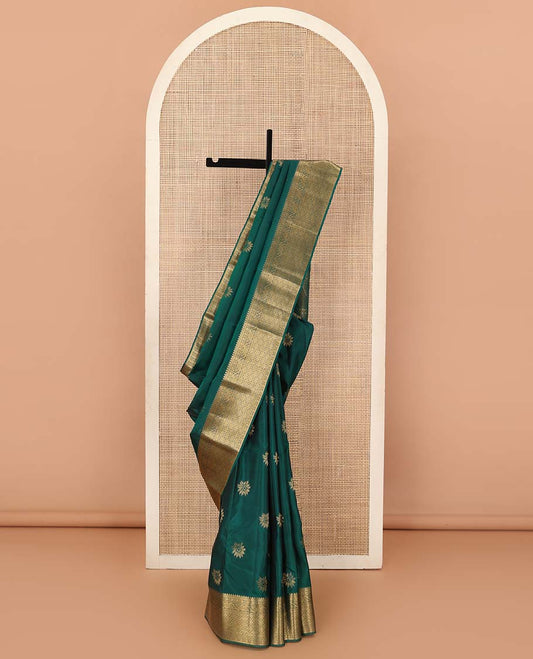 Green floral zari buttas Vasundhara silk mix saree, zari border of thilakam, manga, kodi visiry, and jaal designs, and intricate pallu