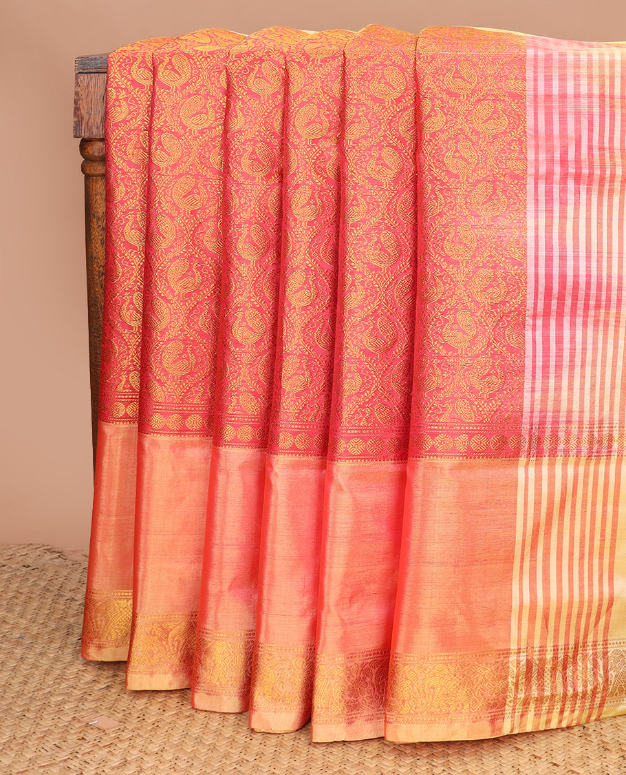 Peach jacquard banana pith saree, traditional zari border, and contrast pallu of stripes