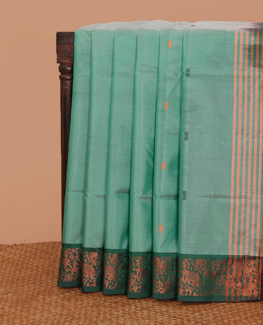 Green thread buttas banana pith saree, contrast animal motifs zari border, and pallu of buttas, and stripes