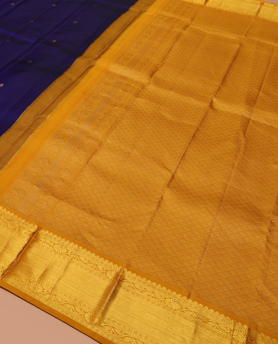 Blue zari buttas silk saree, contrast border of thilakam mokku, manga and floral designs, and jaal pallu
